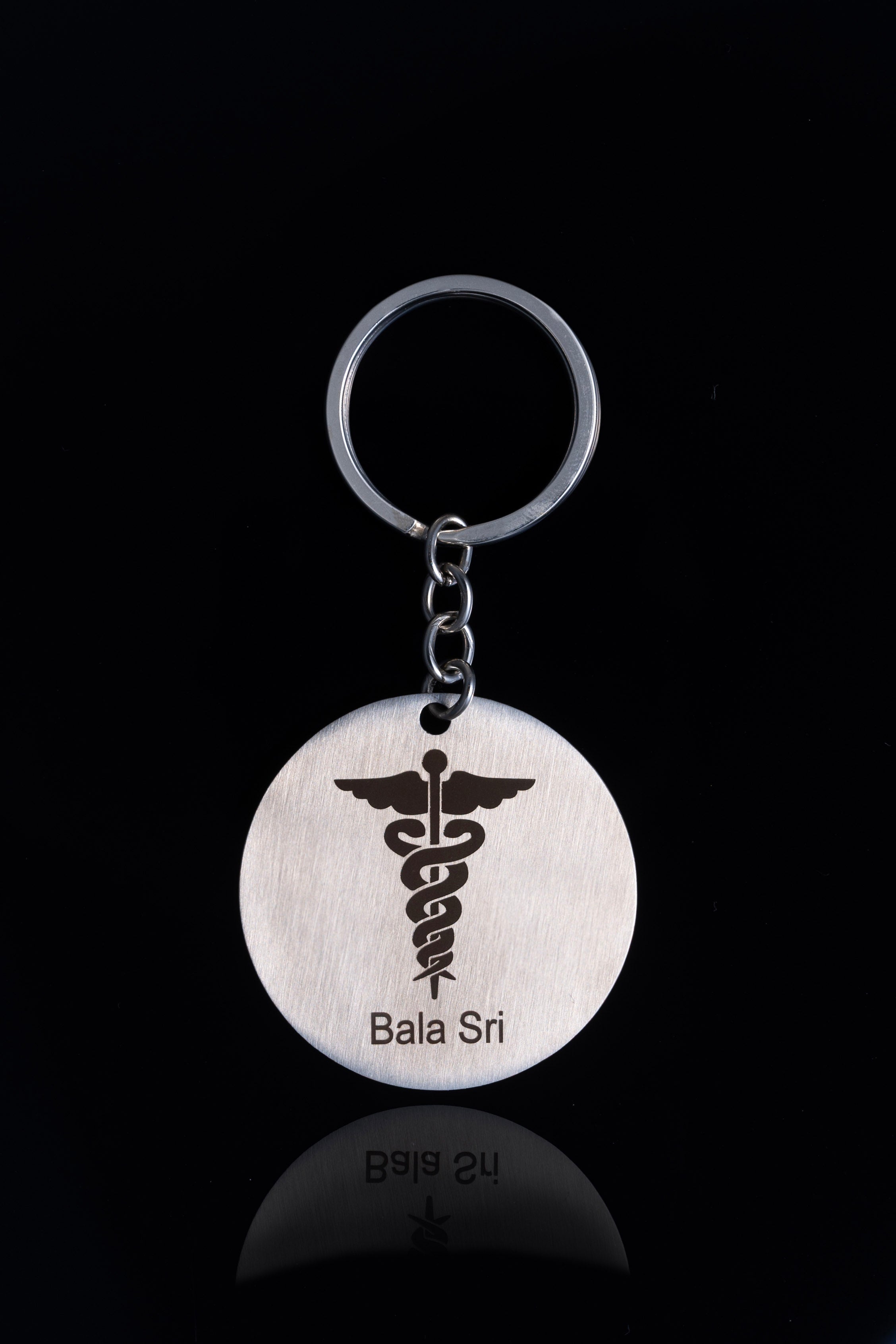 Silver stainless steel keychain with a doctor symbol engraved